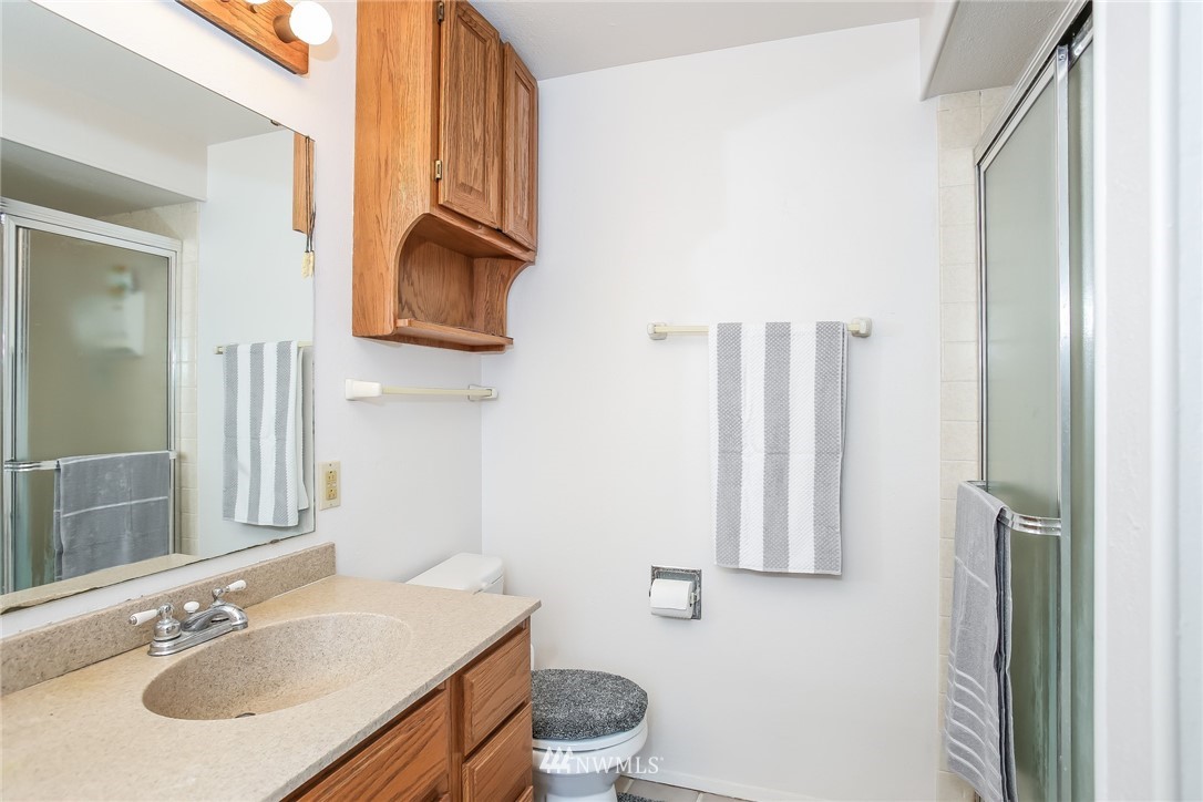 17848 156th Place Southeast Renton, WA 98058 - Photo 11 of 24 a bathroom with a sink and a mirror