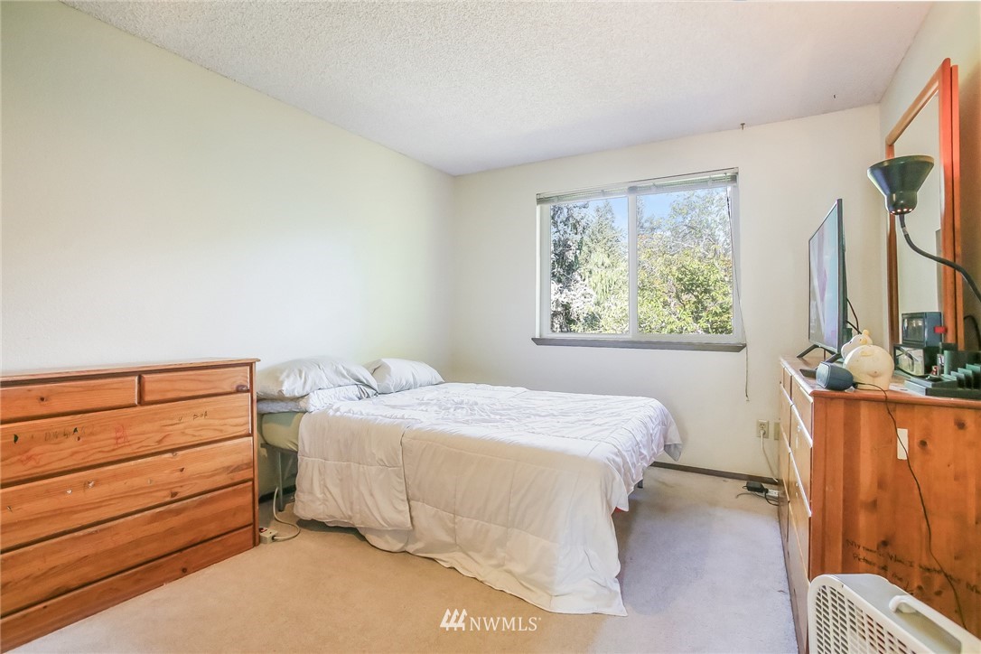 17848 156th Place Southeast Renton, WA 98058 - Photo 13 of 24 a bedroom with a bed and a window