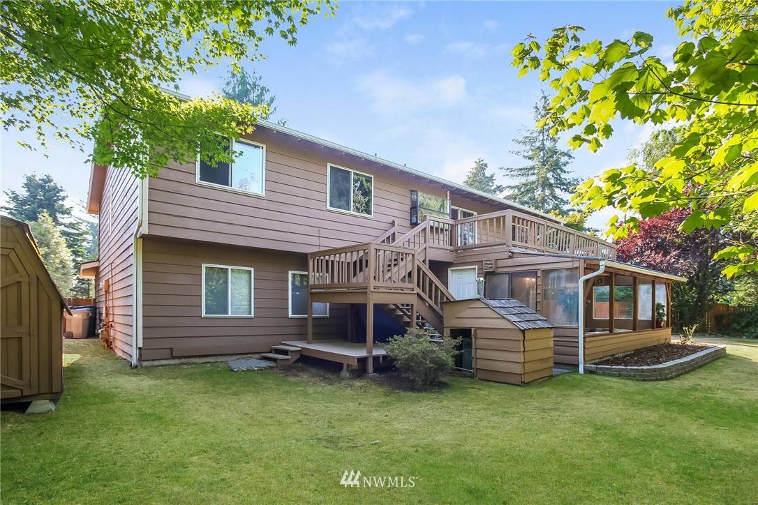 17848 156th Place Southeast Renton, WA 98058 - Photo 20 of 24 a front view of a house with a garden and deck