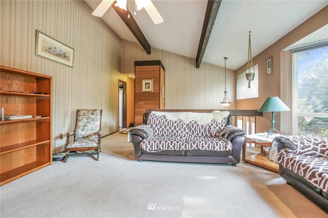 17848 156th Place Southeast Renton, WA 98058 - Photo 4 of 24 a bedroom with a bed couch and window