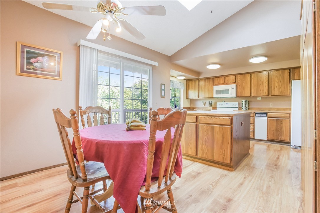 17848 156th Place Southeast Renton, WA 98058 - Photo 5 of 24 a dining room with furniture a window and appliances
