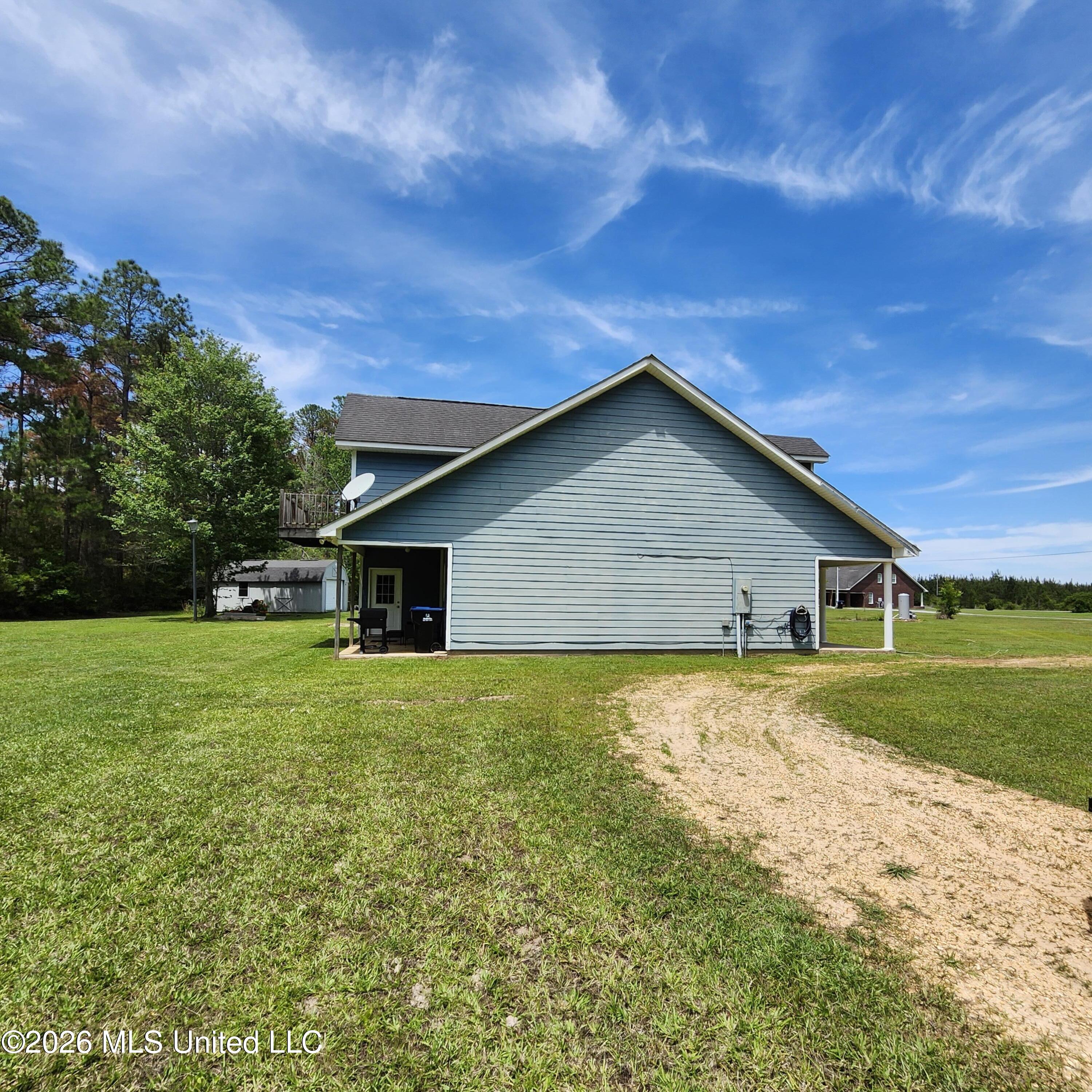 12 Austin Lane Perkinston, MS 39573 - Photo 7 of 54 side view of house from driveway