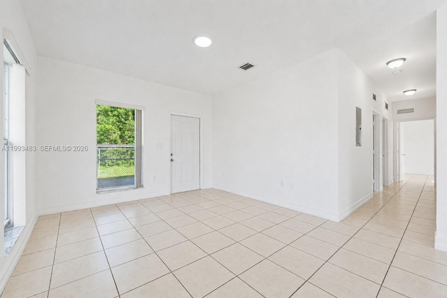 10357 Southwest 178th Street, Unit 10357 Miami, FL 33157 - Photo 10 of 25 a view of an empty room and window