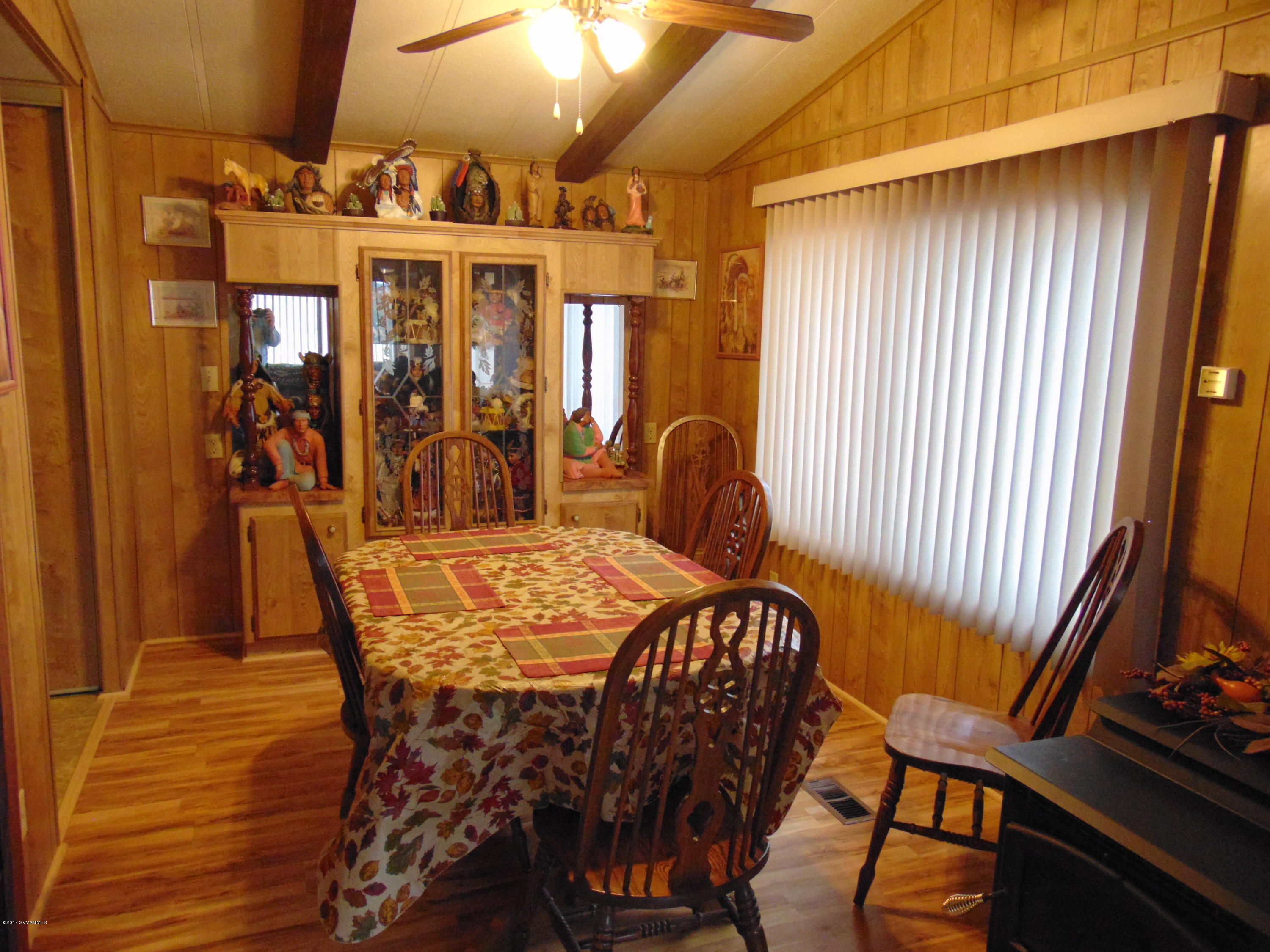 4715 Tagalong Trail Rimrock, AZ 86335 - Photo 12 of 30 a view of a dining room with furniture and chandelier