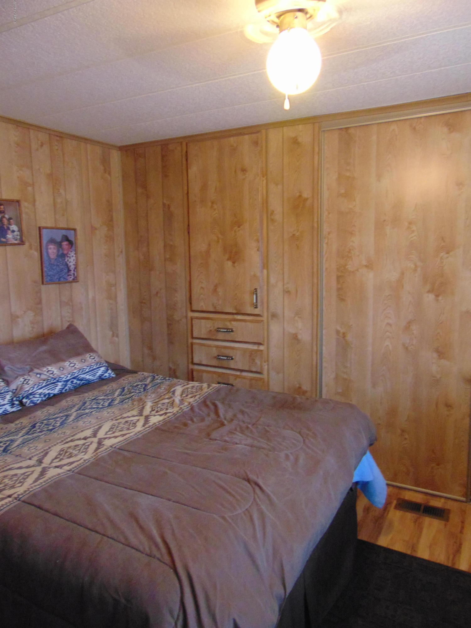 4715 Tagalong Trail Rimrock, AZ 86335 - Photo 17 of 30 a bedroom with a bed and a window
