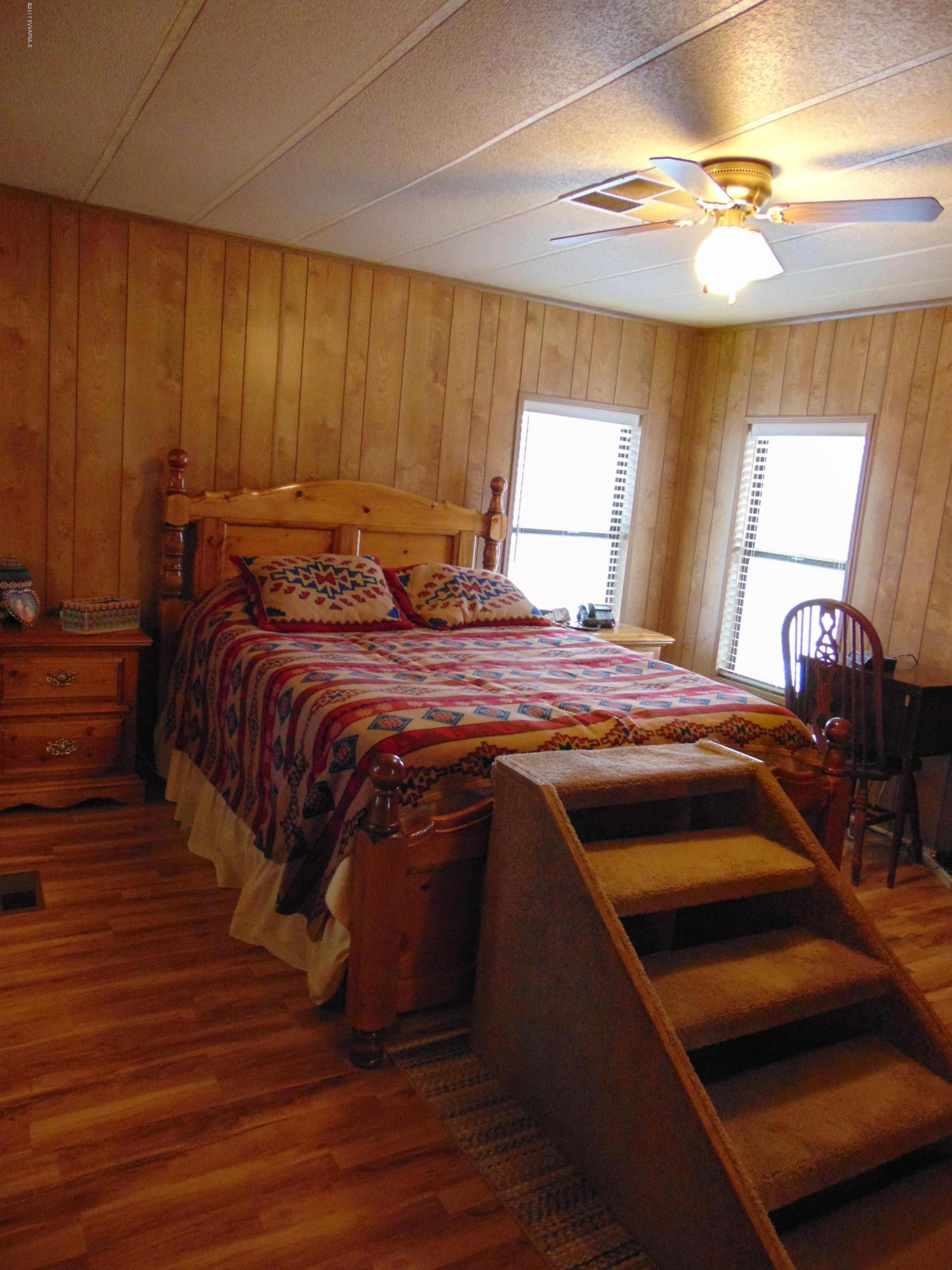 4715 Tagalong Trail Rimrock, AZ 86335 - Photo 21 of 30 a bed sitting in a bedroom next to a window