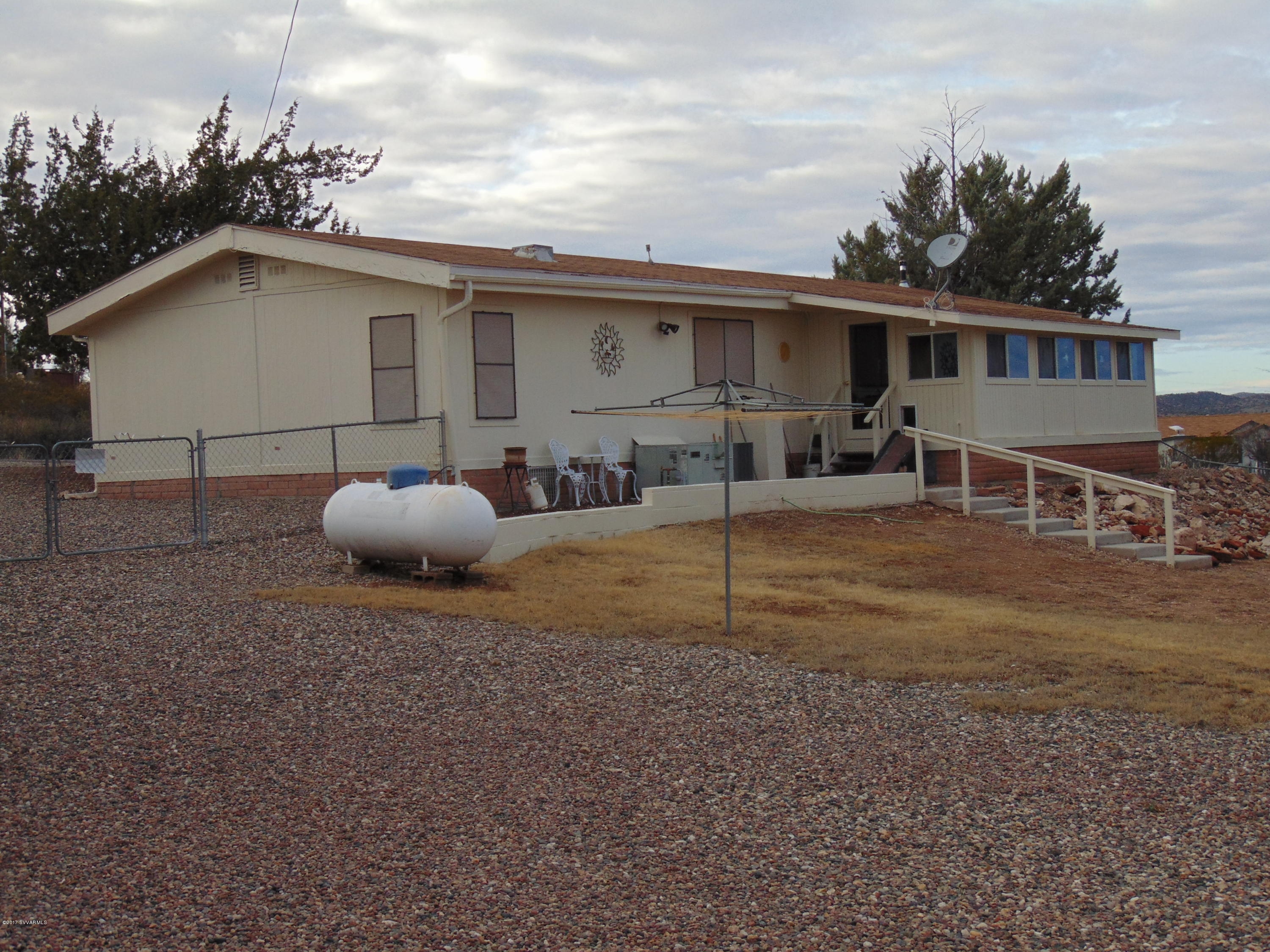 4715 Tagalong Trail Rimrock, AZ 86335 - Photo 30 of 30 a backyard of a house with table and chairs