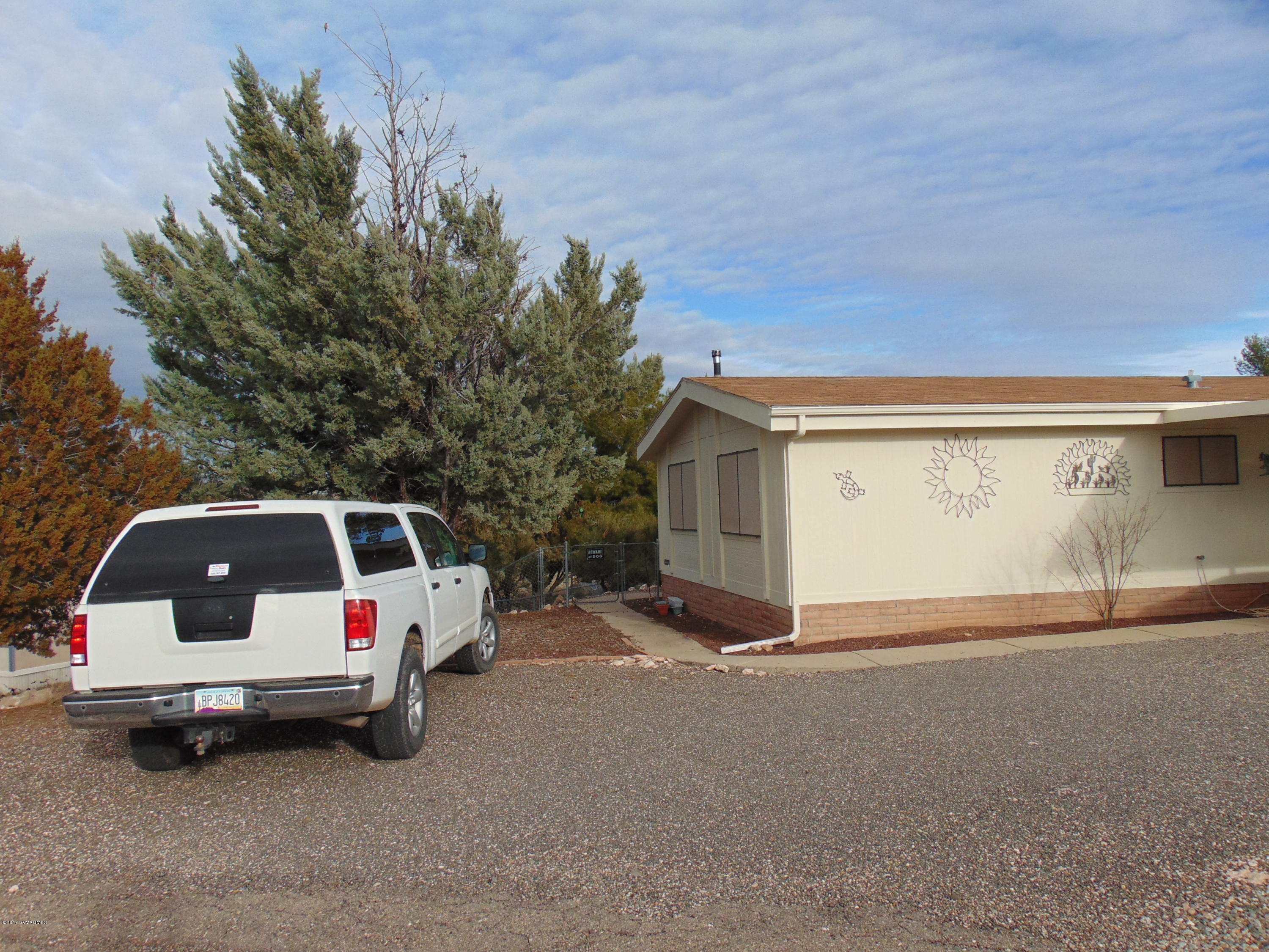4715 Tagalong Trail Rimrock, AZ 86335 - Photo 3 of 30 a white car parked in front of white house