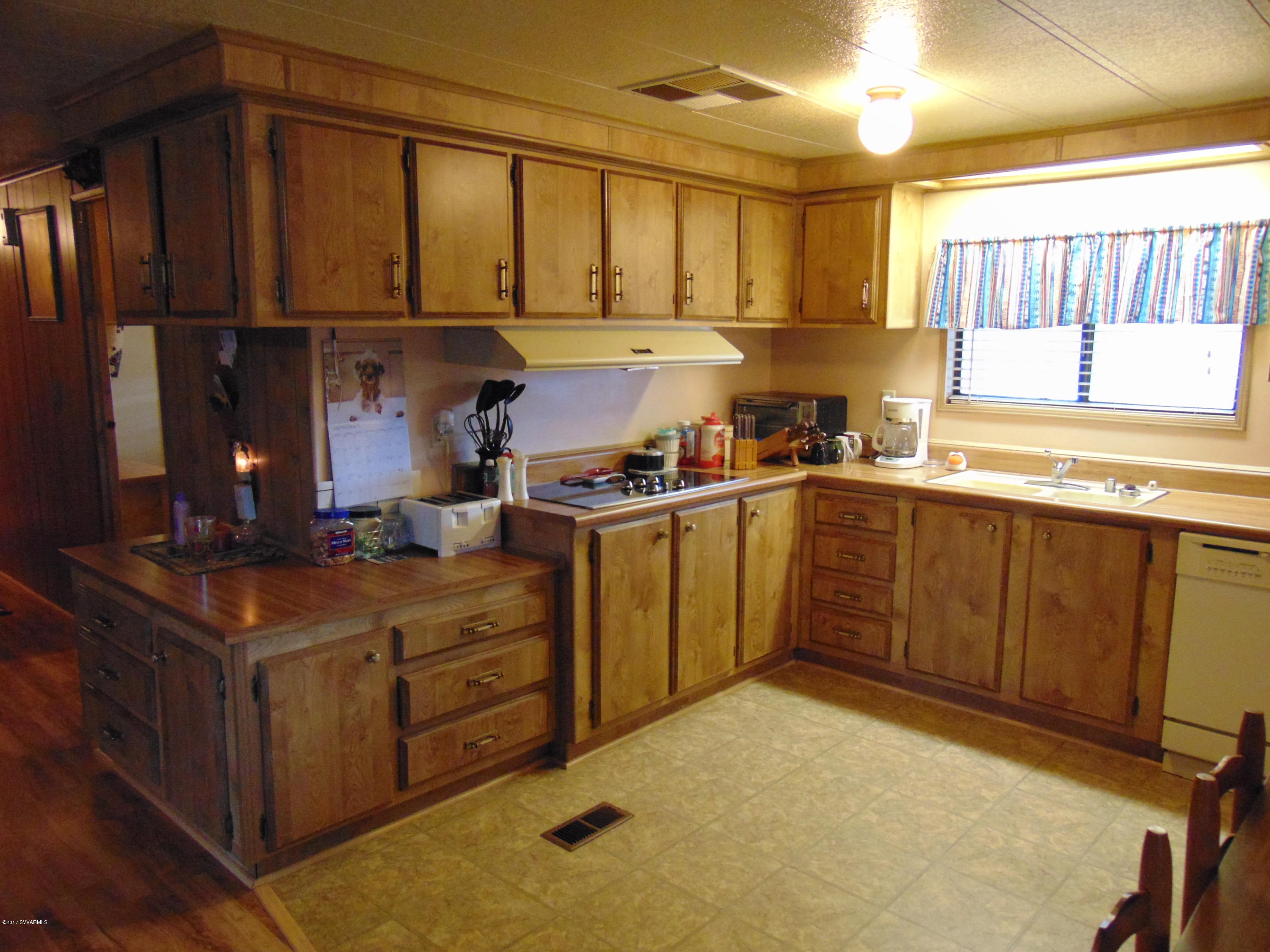 4715 Tagalong Trail Rimrock, AZ 86335 - Photo 8 of 30 a kitchen with sink cabinets and window