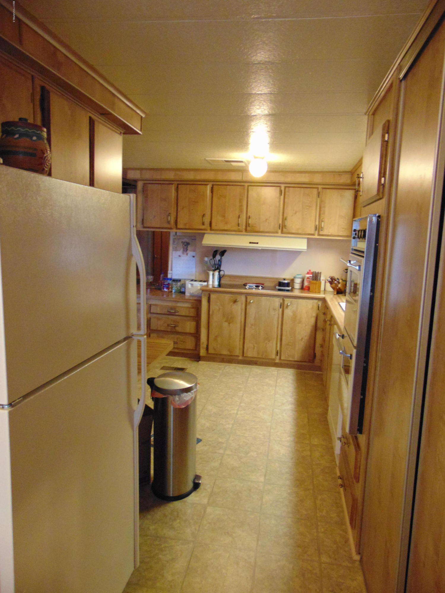 4715 Tagalong Trail Rimrock, AZ 86335 - Photo 10 of 30 a kitchen with refrigerator and washer