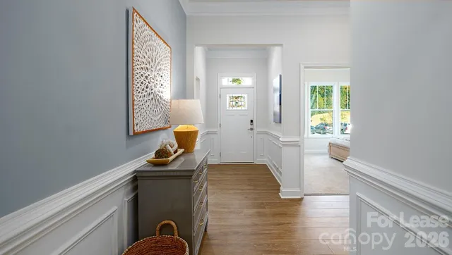 a dining room with glass windows and table