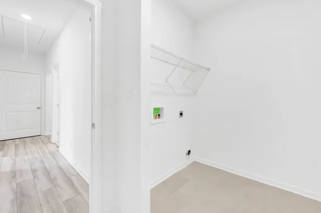 a bathroom with a toilet a sink a tub and mirror