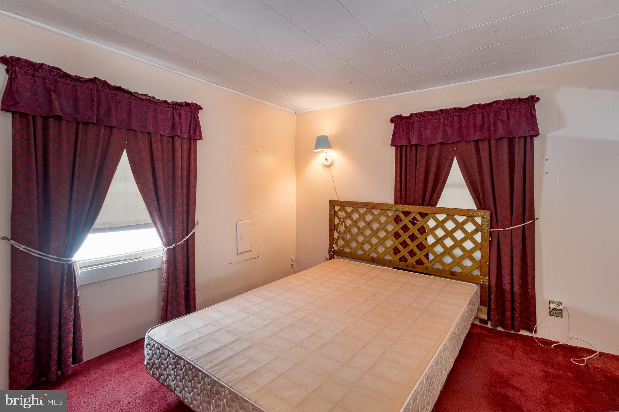 3416 Broadford Road Oakland, MD 21550 - Photo 16 of 23 Cozy bedroom with rich, warm tones.