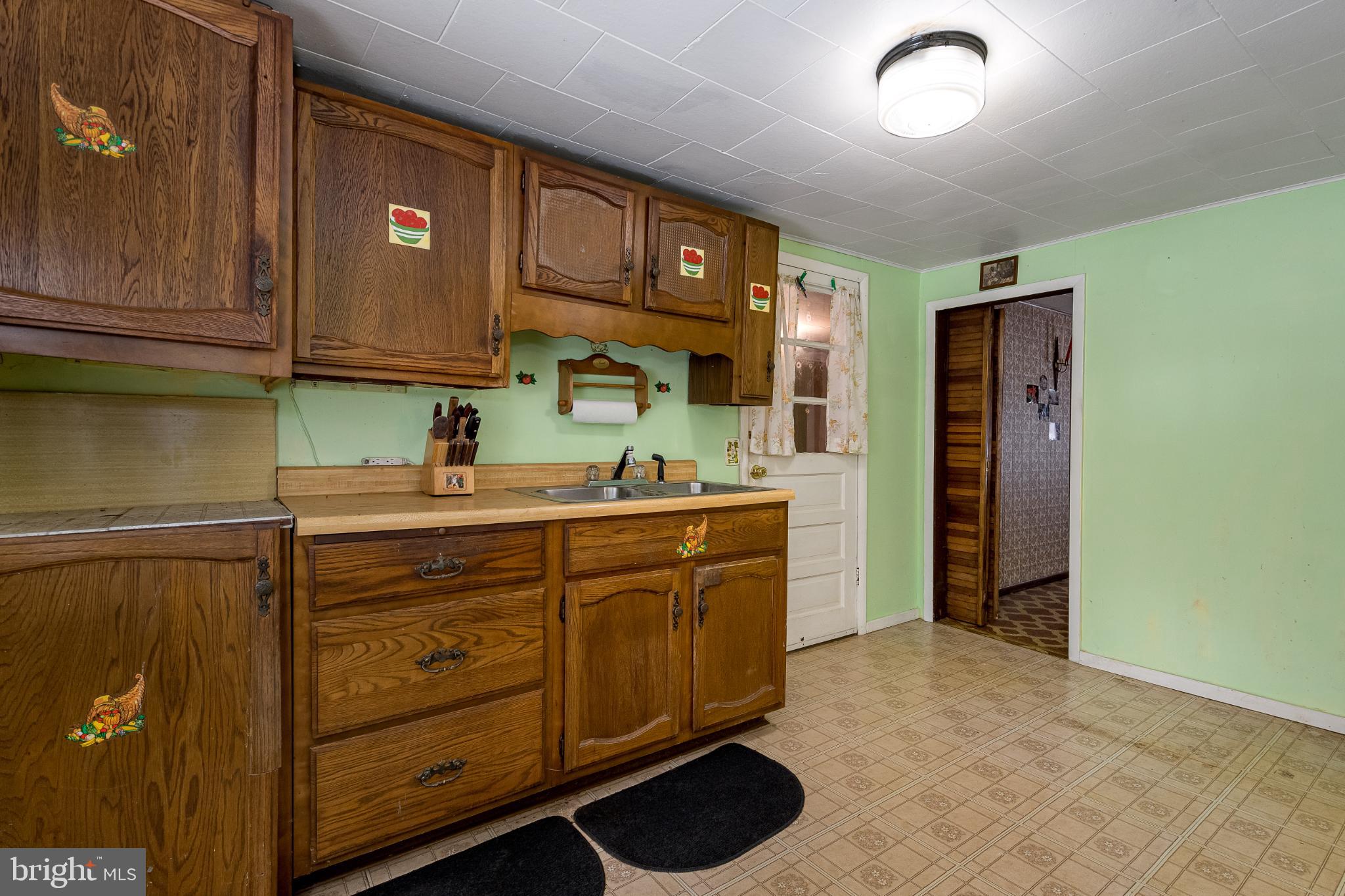 3416 Broadford Road Oakland, MD 21550 - Photo 5 of 23 Charming vintage kitchen with wooden cabinetry.