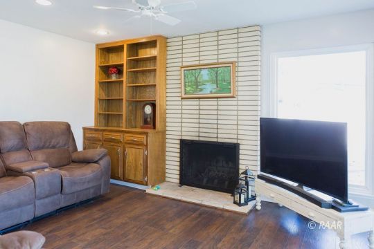 730 Scott Circle Ridgecrest, CA 93555 - Photo 12 of 32 a living room with furniture and a fireplace