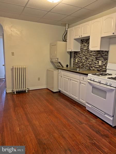 121 South Queen Street, Unit 3 York, PA 17403 - Photo 3 of 8 a kitchen with granite countertop white cabinets and white appliances