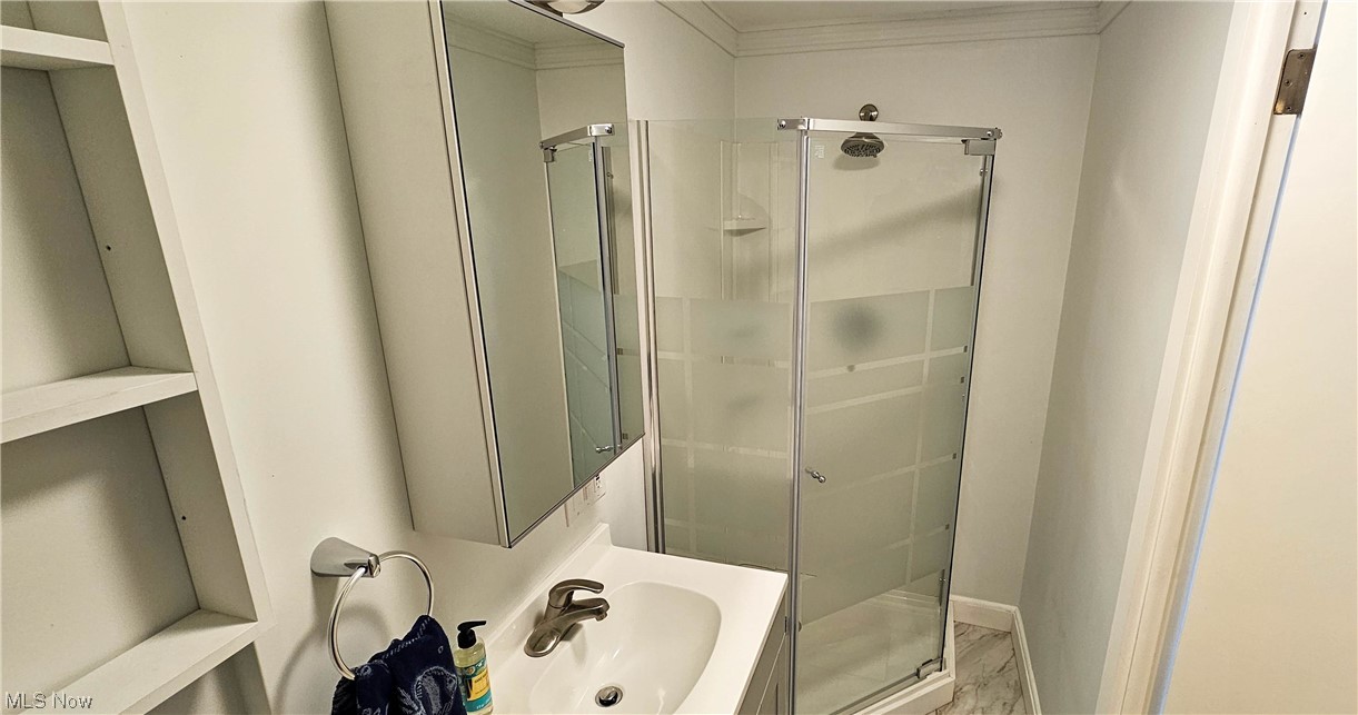 19755 Upper Terrace Road Euclid, OH 44117 - Photo 26 of 38 Bathroom with shower and built in shelving.