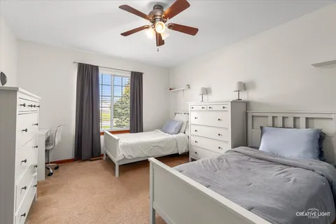 a bedroom with bed and window