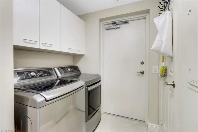 a close view of a utility room with washer and dryer