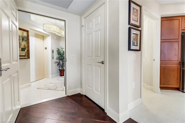 a view of an entryway with wooden floor