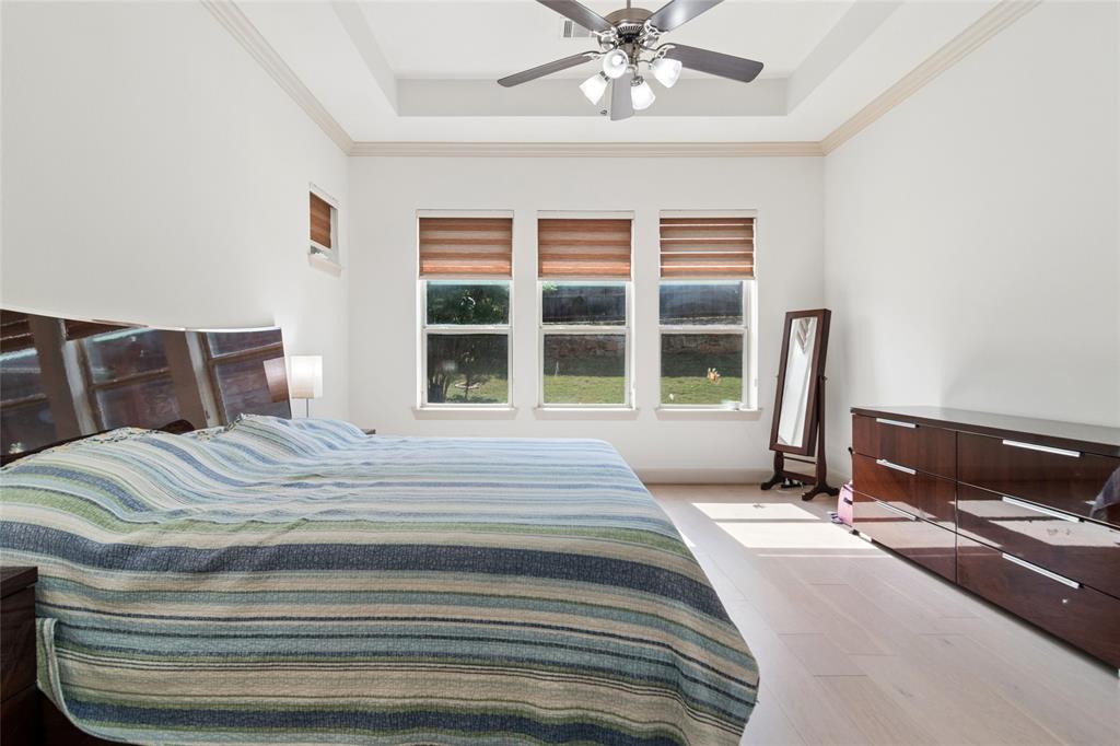 6715 Castillo Street Irving, TX 75039 - Photo 11 of 24 a bedroom with a bed and a large window