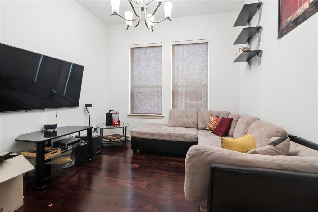 6715 Castillo Street Irving, TX 75039 - Photo 17 of 24 a living room with furniture and a flat screen tv