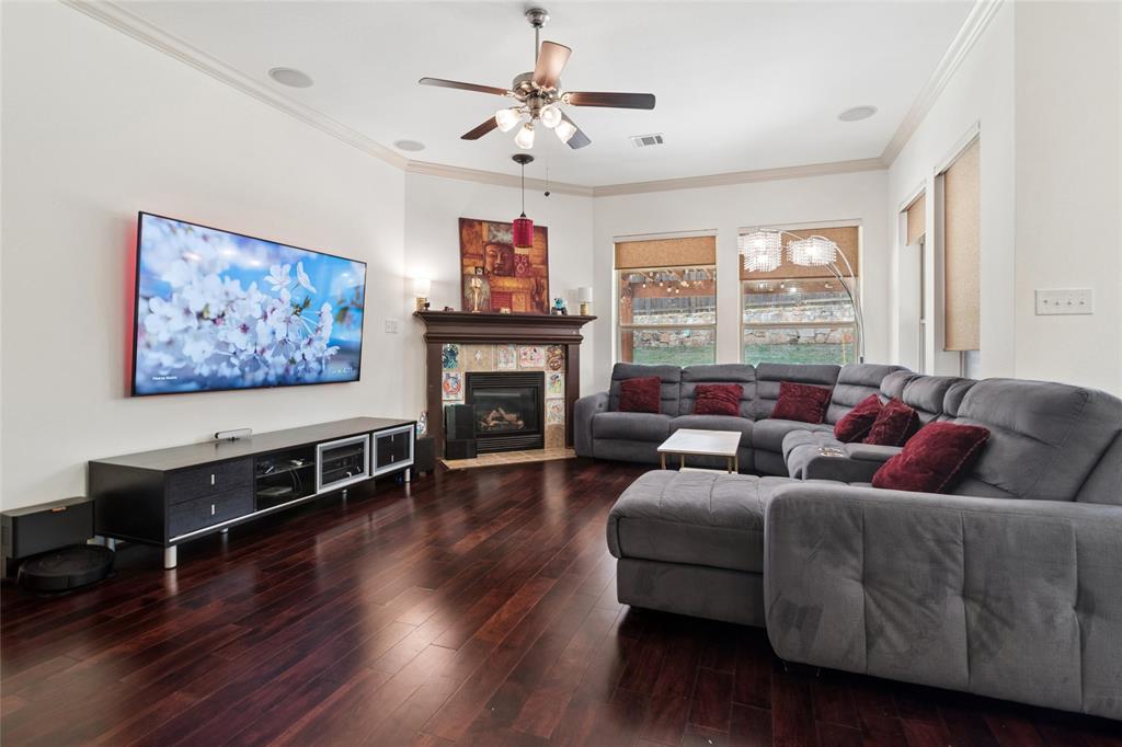 6715 Castillo Street Irving, TX 75039 - Photo 2 of 24 a living room with furniture flat screen tv and a fireplace
