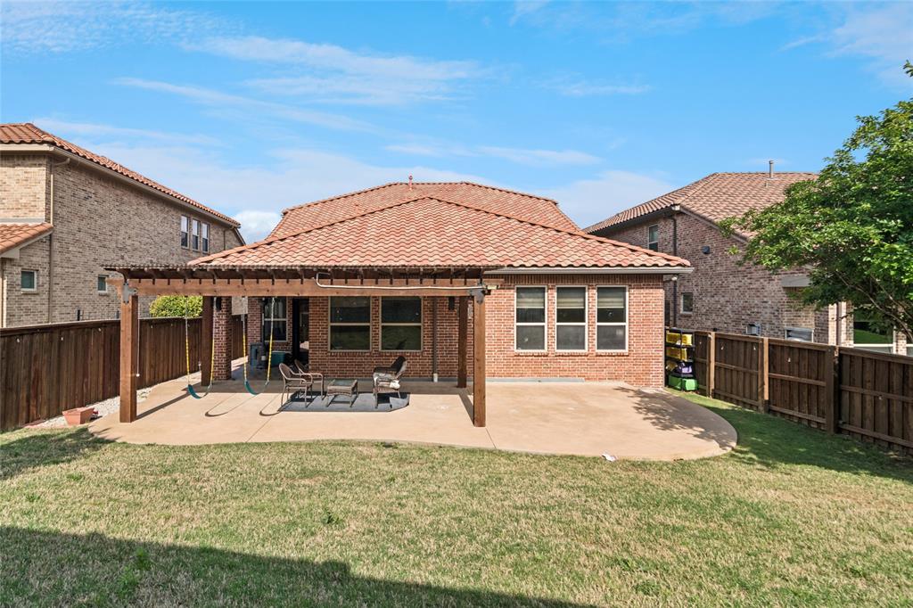 6715 Castillo Street Irving, TX 75039 - Photo 23 of 24 a front view of a house with a garden and patio