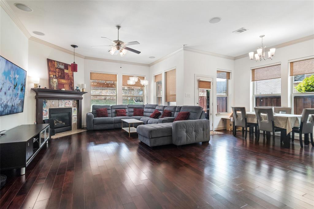 6715 Castillo Street Irving, TX 75039 - Photo 3 of 24 a living room with furniture dining table and a fireplace