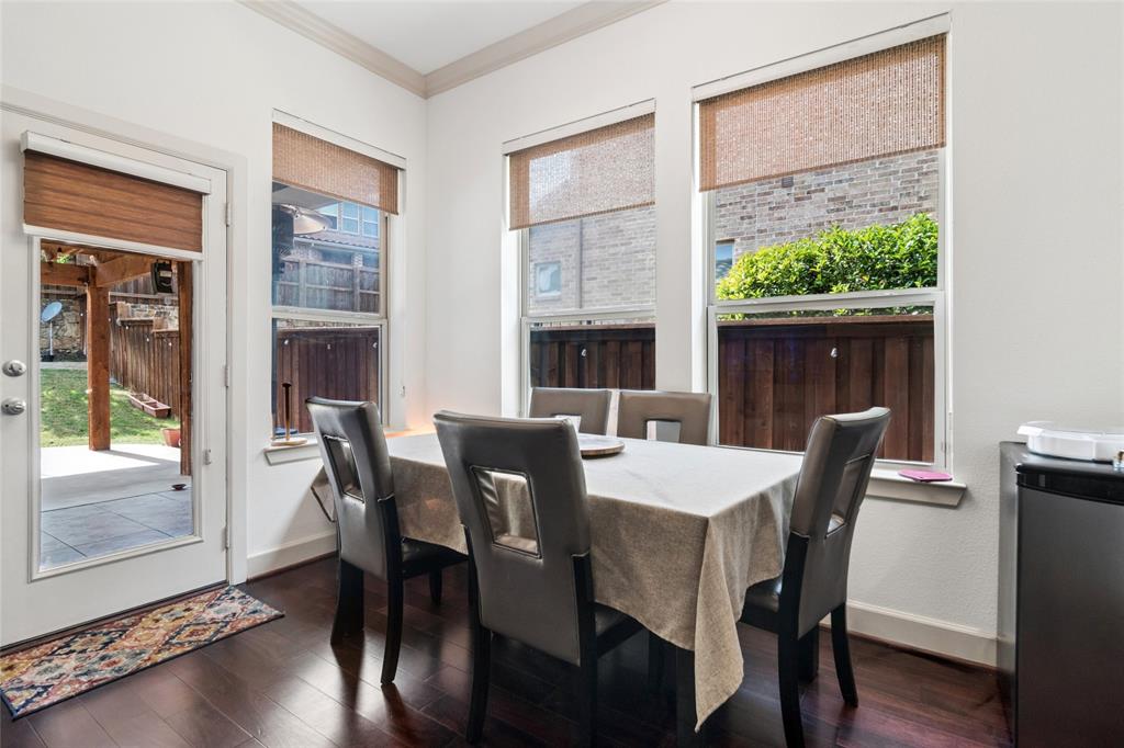 6715 Castillo Street Irving, TX 75039 - Photo 8 of 24 a view of a dining room with furniture window and wooden floor