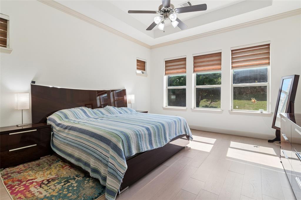 6715 Castillo Street Irving, TX 75039 - Photo 10 of 24 a bedroom with a large bed and a window