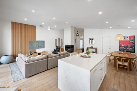 a kitchen that has a sink and a stove in it