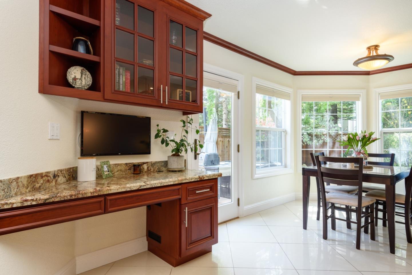 376 Eagle Trace Drive Half Moon Bay, CA 94019 - Photo 11 of 43 a living room with stainless steel appliances granite countertop a stove and a chair