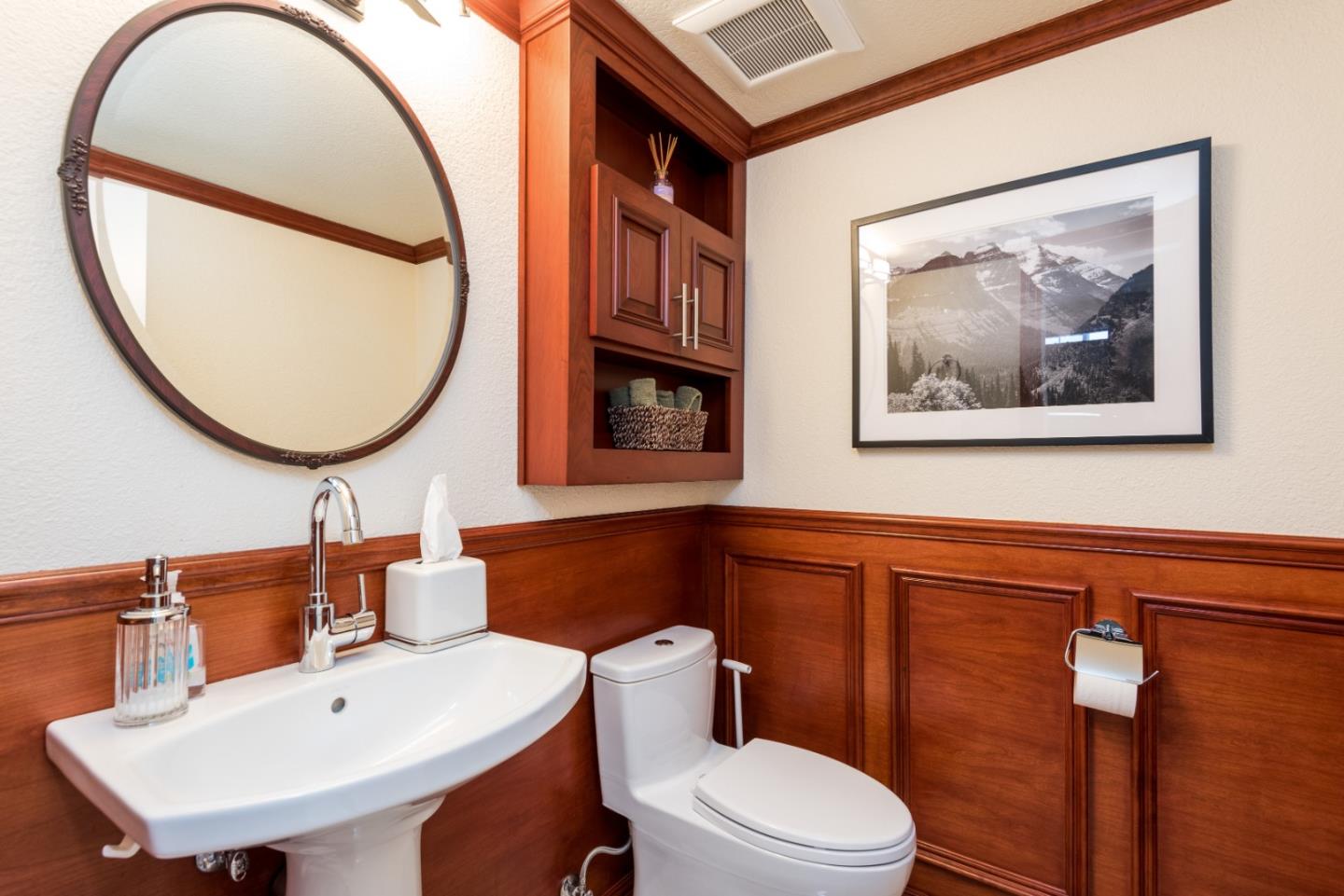 376 Eagle Trace Drive Half Moon Bay, CA 94019 - Photo 14 of 43 a bathroom with a toilet a sink and a mirror
