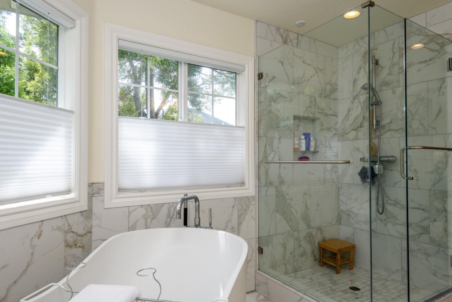 376 Eagle Trace Drive Half Moon Bay, CA 94019 - Photo 19 of 43 a bathroom with a bathtub and shower