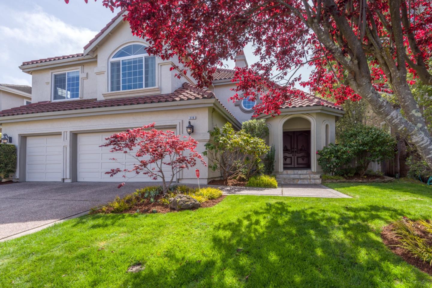 376 Eagle Trace Drive Half Moon Bay, CA 94019 - Photo 2 of 43 a front view of a house with garden