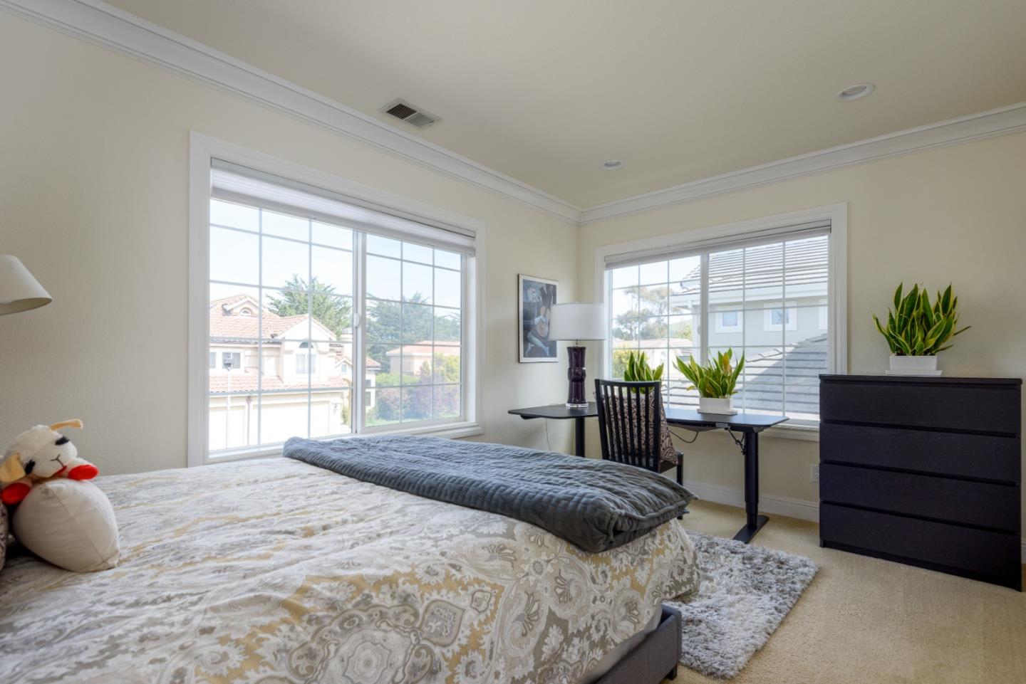 376 Eagle Trace Drive Half Moon Bay, CA 94019 - Photo 22 of 43 a bedroom with a bed and a window