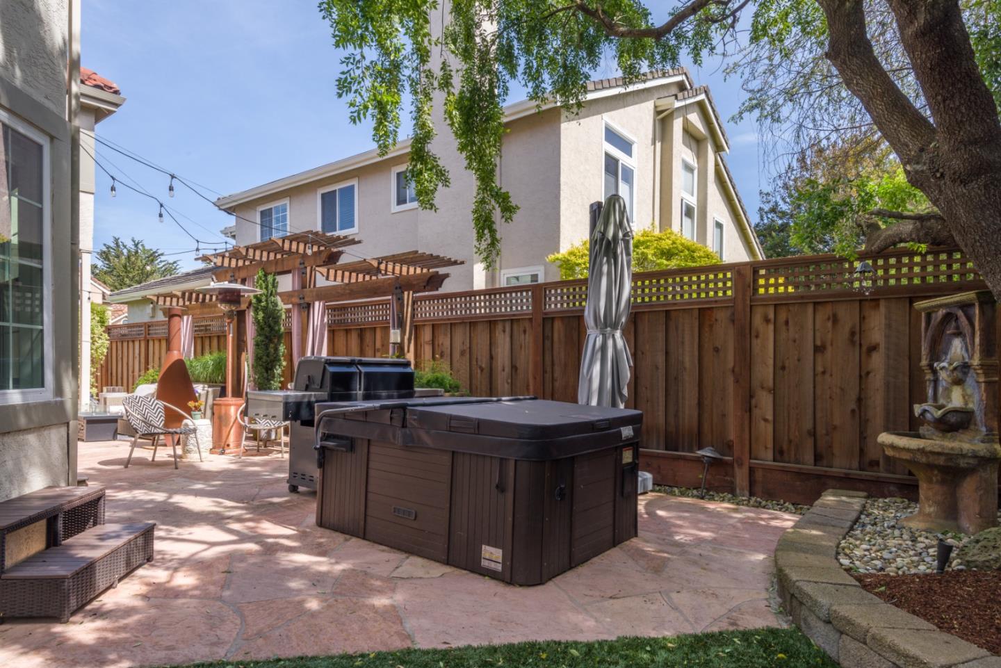 376 Eagle Trace Drive Half Moon Bay, CA 94019 - Photo 28 of 43 a view of a house with backyard and sitting area