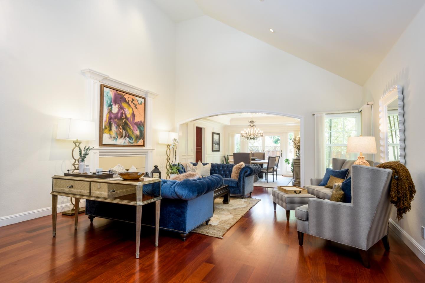 376 Eagle Trace Drive Half Moon Bay, CA 94019 - Photo 4 of 43 a living room with fireplace furniture and a wooden floor