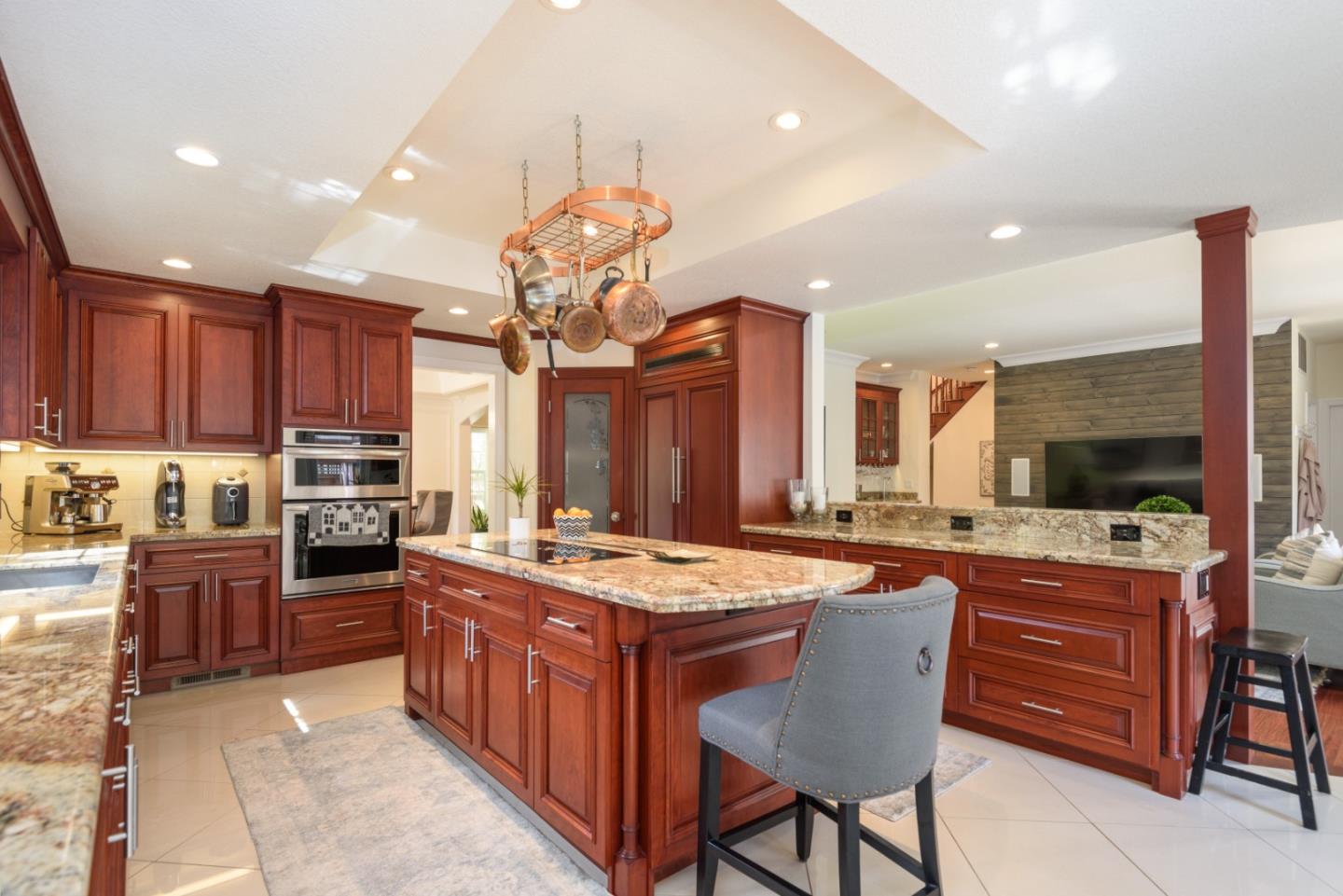 376 Eagle Trace Drive Half Moon Bay, CA 94019 - Photo 8 of 43 a kitchen with stainless steel appliances a stove a sink a oven a dining table and chairs