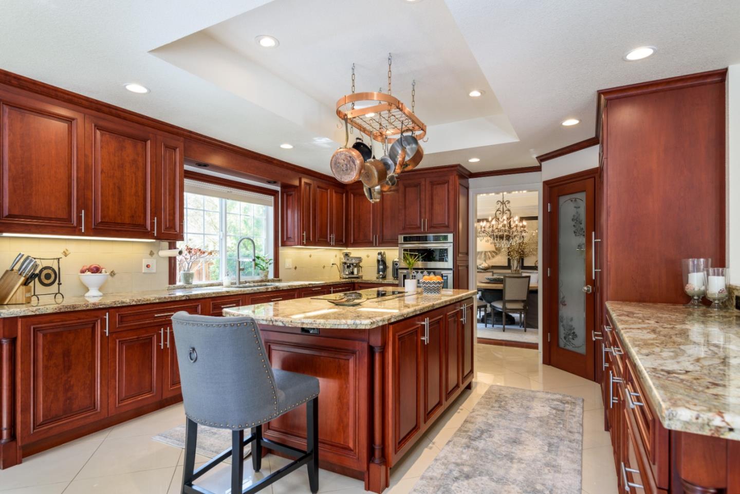 376 Eagle Trace Drive Half Moon Bay, CA 94019 - Photo 9 of 43 a kitchen with granite countertop kitchen island stainless steel appliances a sink stove and cabinets
