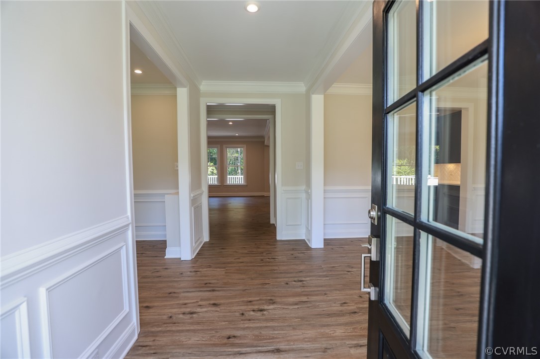 4353 Landfall Drive Williamsburg, VA 23185 - Photo 2 of 13 a view of a hallway with wooden floor and staircase