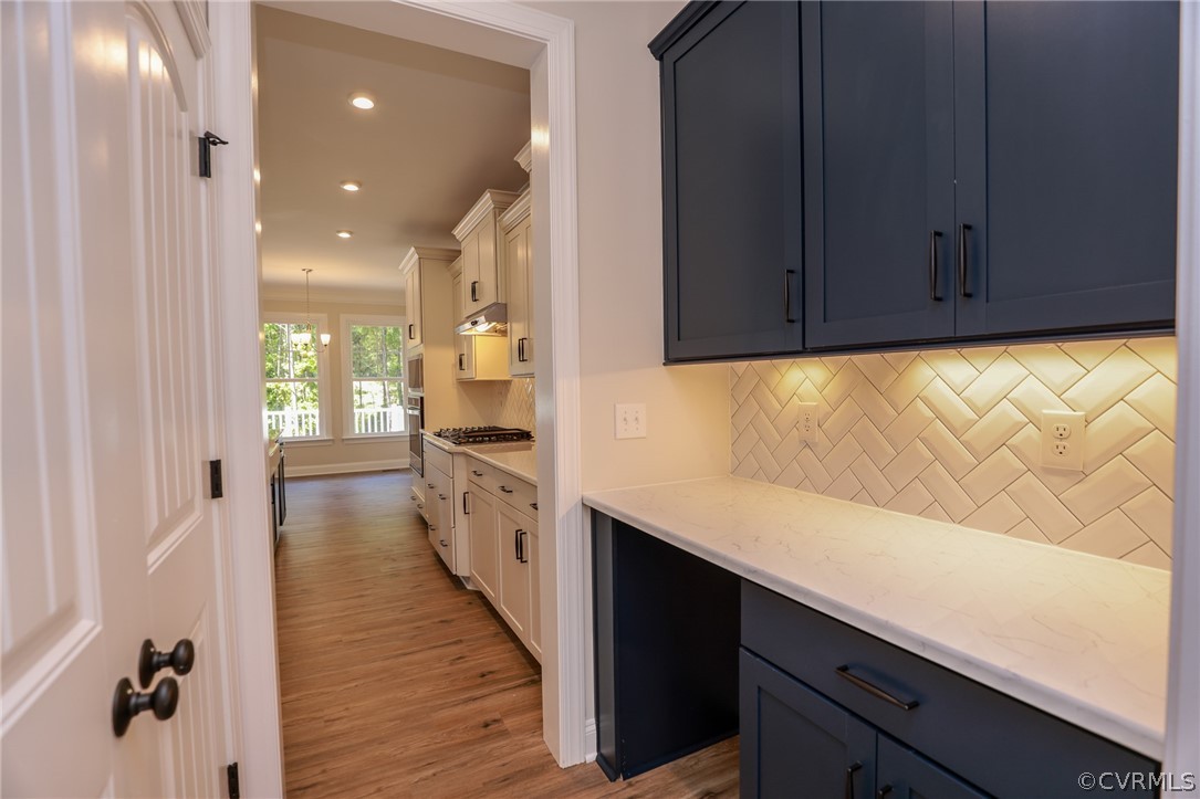 4353 Landfall Drive Williamsburg, VA 23185 - Photo 5 of 13 a kitchen with granite countertop cabinets and wooden floor