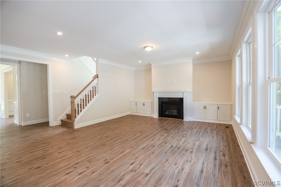 4353 Landfall Drive Williamsburg, VA 23185 - Photo 6 of 13 a view of an empty room with wooden floor and a window