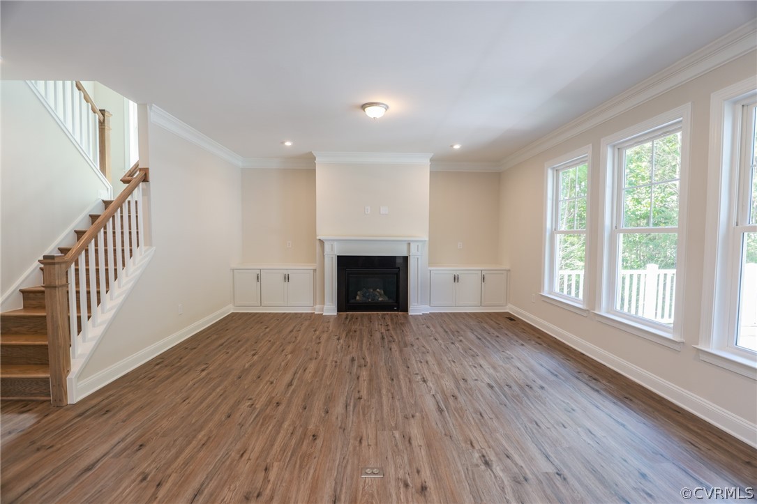 4353 Landfall Drive Williamsburg, VA 23185 - Photo 7 of 13 a view of an empty room with wooden floor and a window
