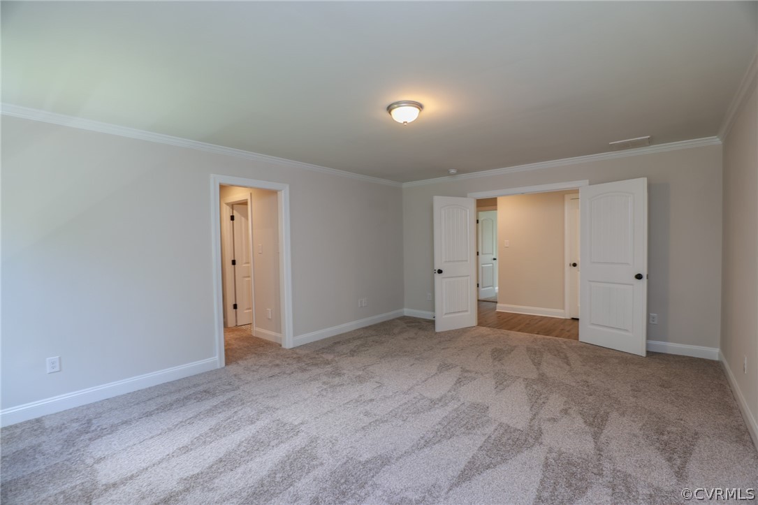 4353 Landfall Drive Williamsburg, VA 23185 - Photo 8 of 13 a view of an empty room and wooden floor & closet area