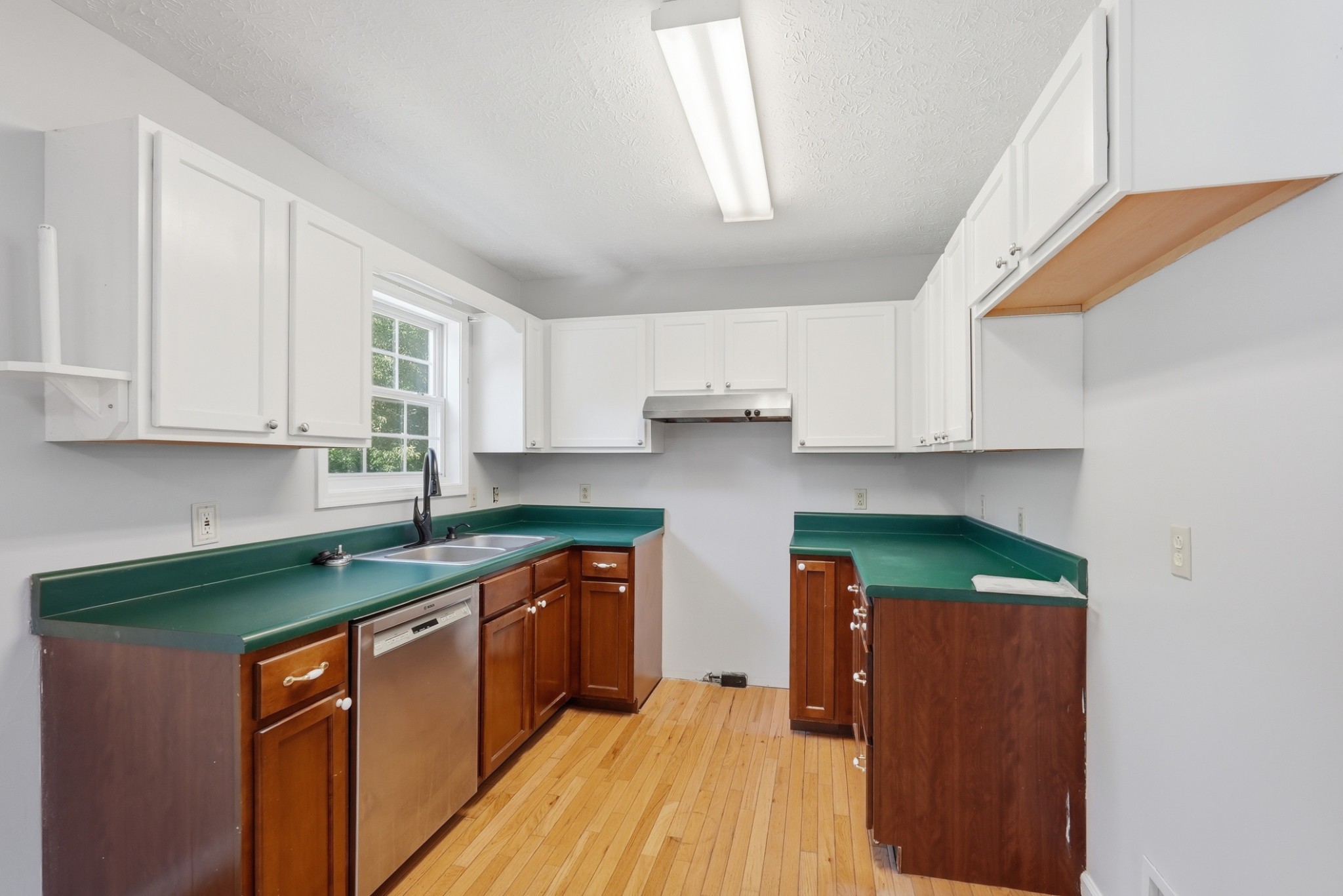4877 Swafford Road Cookeville, TN 38501 - Photo 24 of 28 a kitchen with stainless steel appliances granite countertop a sink stove and cabinets