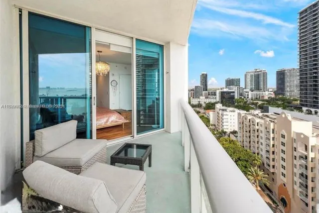 a balcony with furniture and a balcony