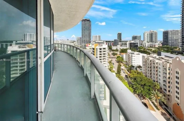 a view of a balcony with chairs