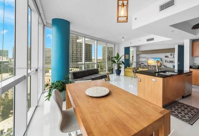 a living room with furniture and a table